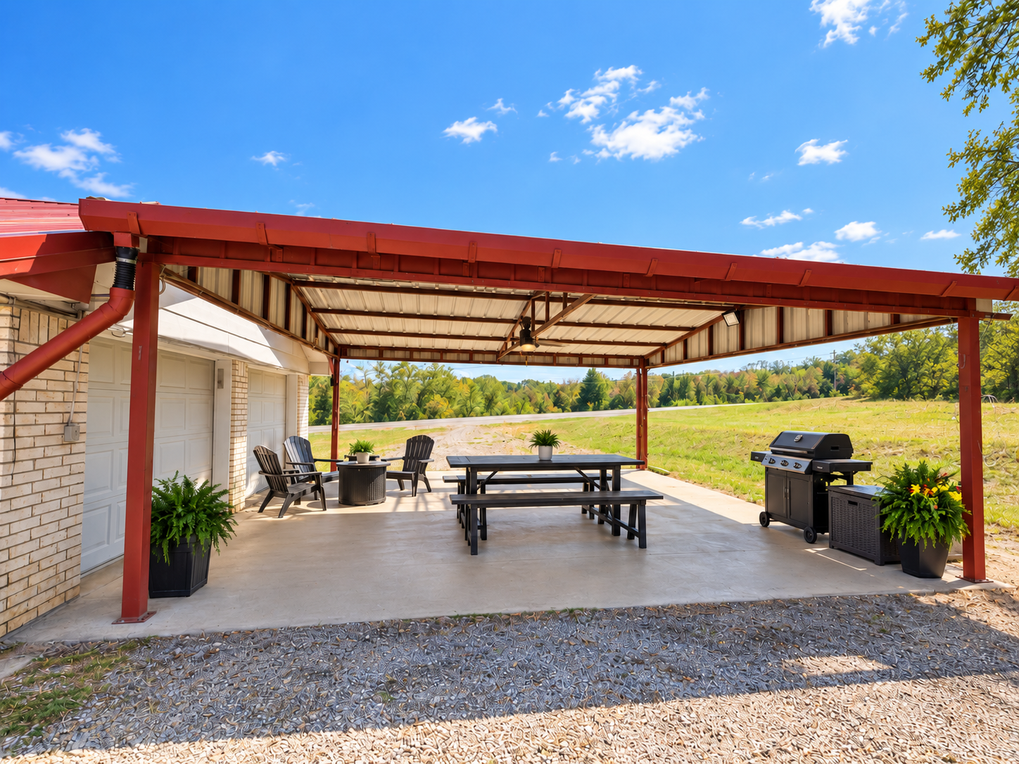 Covered grill and gathering pavilion at Bob's Lake Country Motel with picnic-style seating and grill